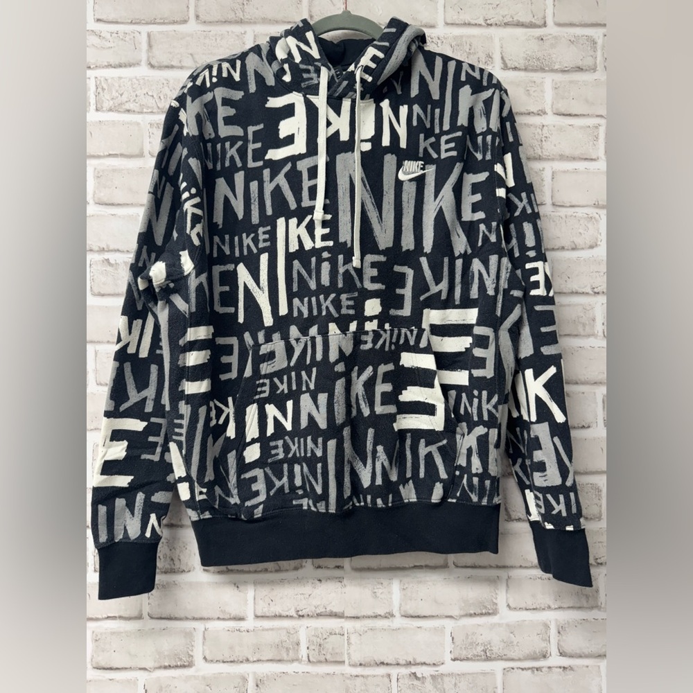 Nike hoodie men’s small with black and white Nike logo all over print.